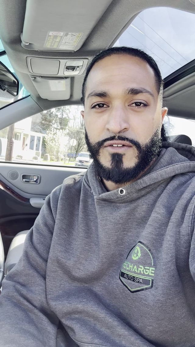 Kamal Malik, owner of Recharge Auto Spa, in a Recharge hoodie